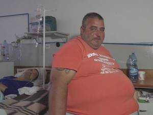 Obez, cu probleme varicoase şi cu hernie ombilicală, Oliver Postolachi nu avea cum să ajungă în apartamentul său